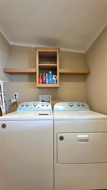 36740 Strand Drive Zephyrhills, FL 33542 - Photo 31 of 74 a utility room with dryer and washer