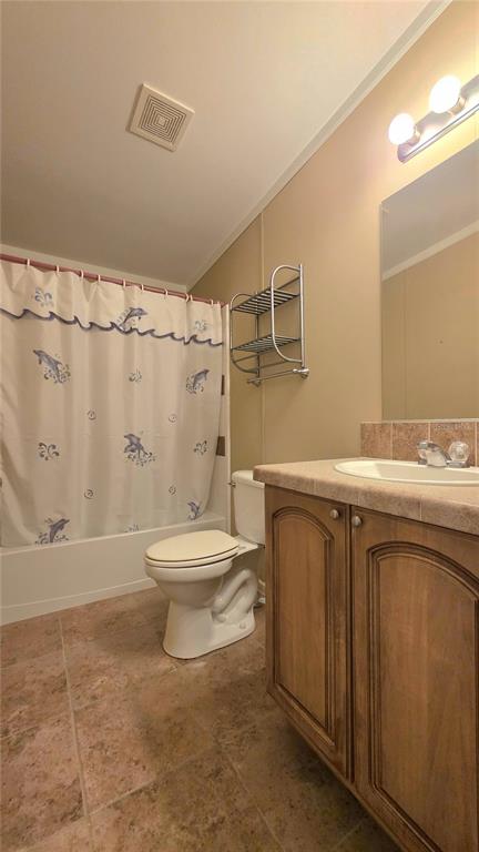 36740 Strand Drive Zephyrhills, FL 33542 - Photo 32 of 74 a bathroom with a sink a toilet and shower