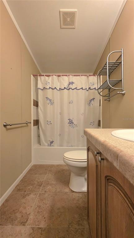 36740 Strand Drive Zephyrhills, FL 33542 - Photo 33 of 74 a bathroom with a granite countertop sink toilet and shower