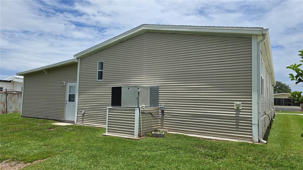 36740 Strand Drive Zephyrhills, FL 33542 - Photo 8 of 74 a front view of a house with a yard