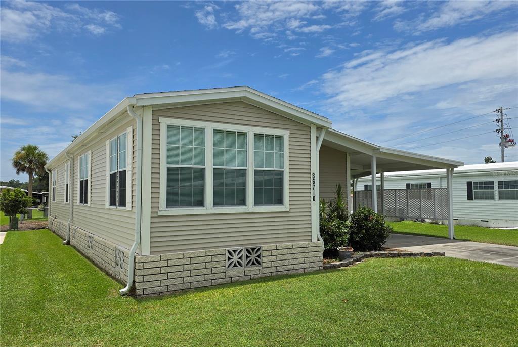 36740 Strand Drive Zephyrhills, FL 33542 - Photo 10 of 74 a view of a house with a yard