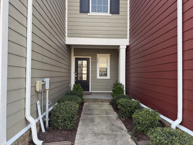 a view of a pathway besides a house