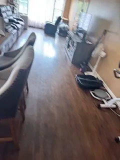 a room with furniture and gym equipment