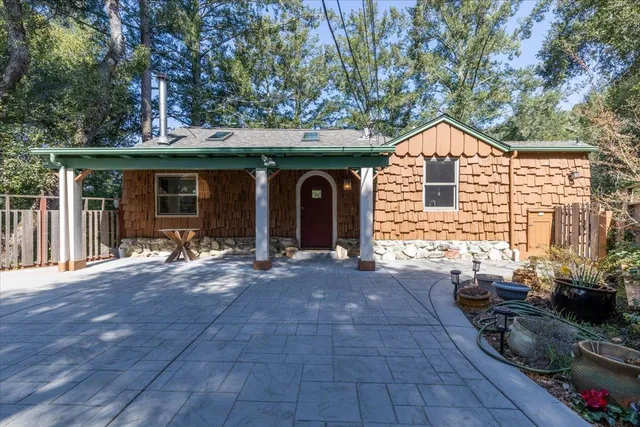 a view of a house with floor to ceiling windows and a basket ball poll
