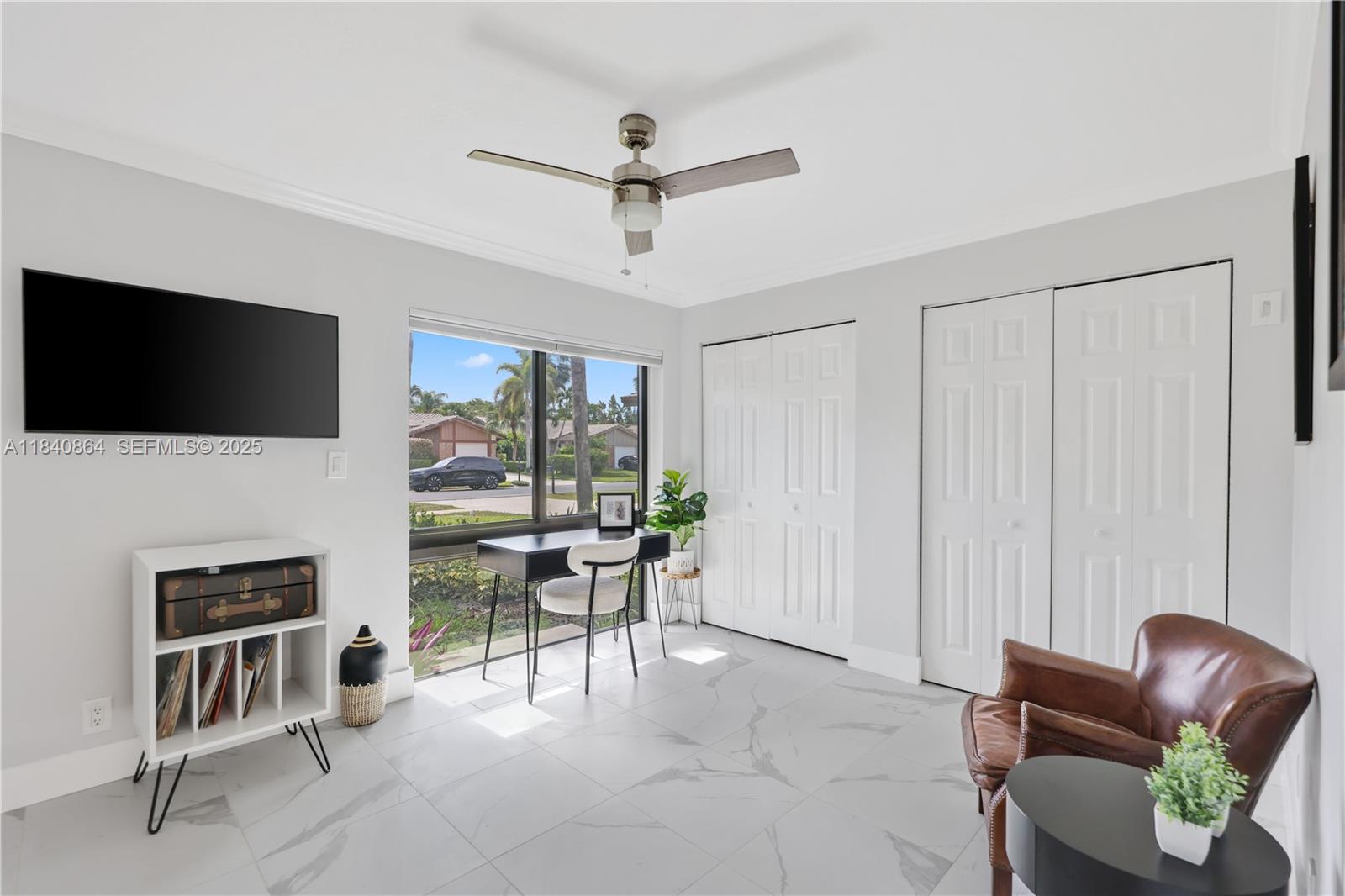 19654 Back 9 Drive Boca Raton, FL 33498 - Photo 14 of 35 a living room with furniture and a flat screen tv