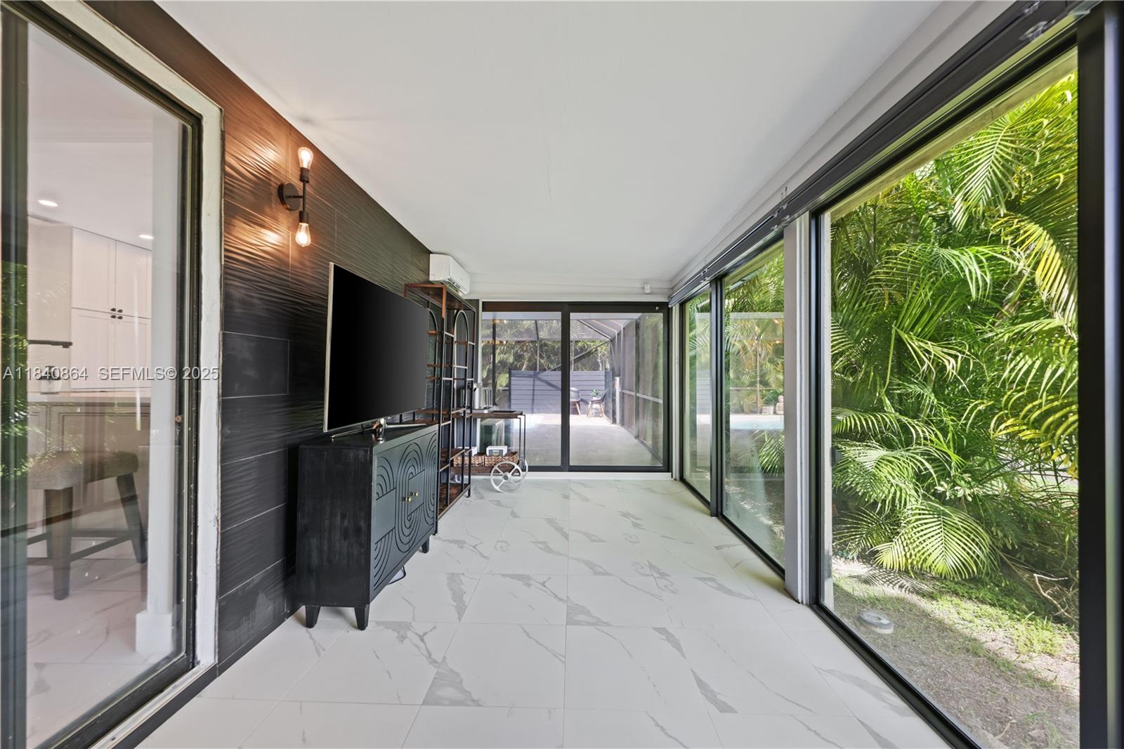 19654 Back 9 Drive Boca Raton, FL 33498 - Photo 22 of 35 a view of a living room hardwood floor and a large window