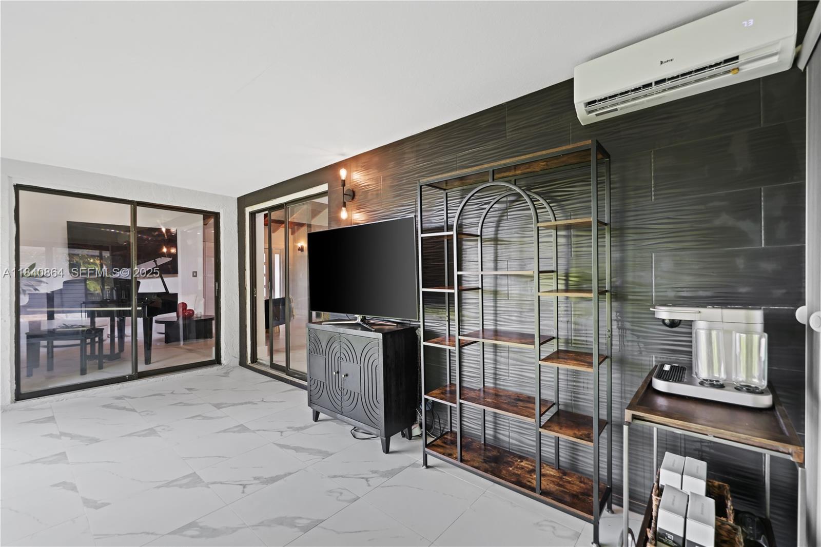 19654 Back 9 Drive Boca Raton, FL 33498 - Photo 23 of 35 a livingroom with furniture and a flat screen tv