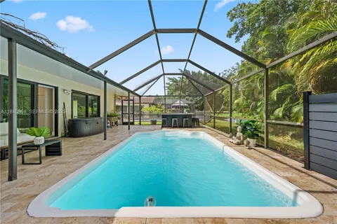 a view of a backyard with sitting area