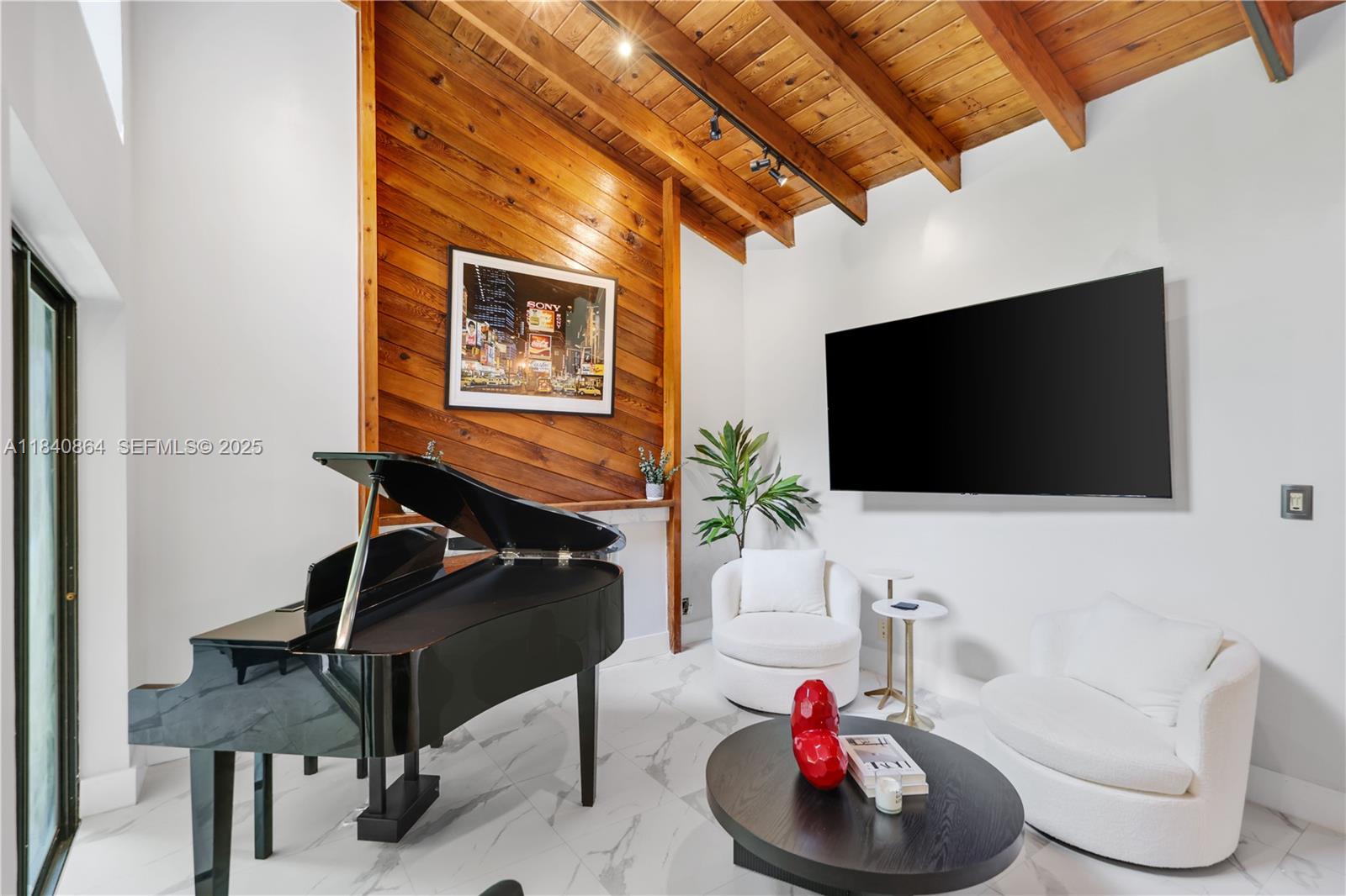 19654 Back 9 Drive Boca Raton, FL 33498 - Photo 3 of 35 a living room with furniture and a flat screen tv