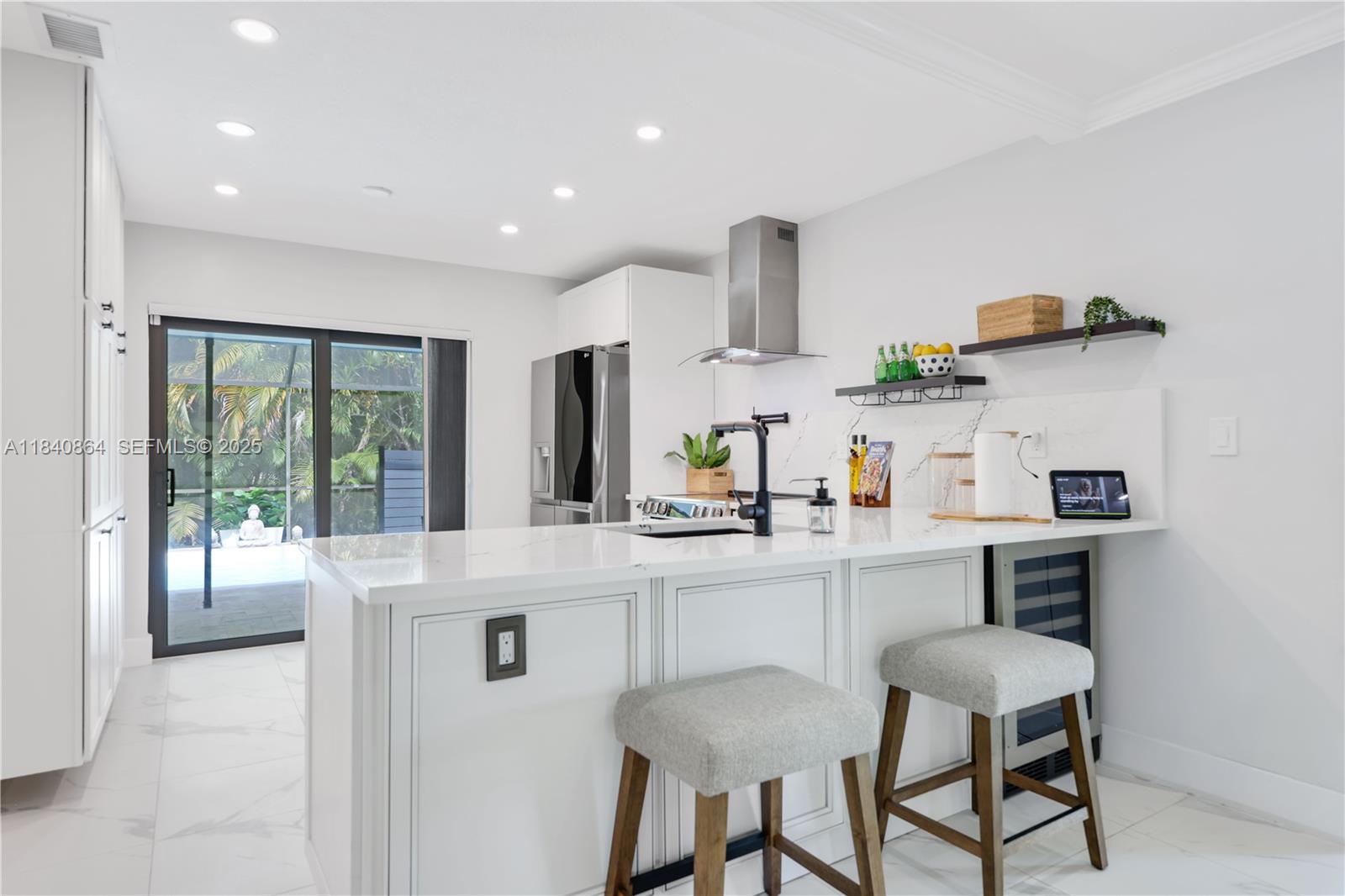 19654 Back 9 Drive Boca Raton, FL 33498 - Photo 7 of 35 a kitchen with stainless steel appliances a sink and a refrigerator