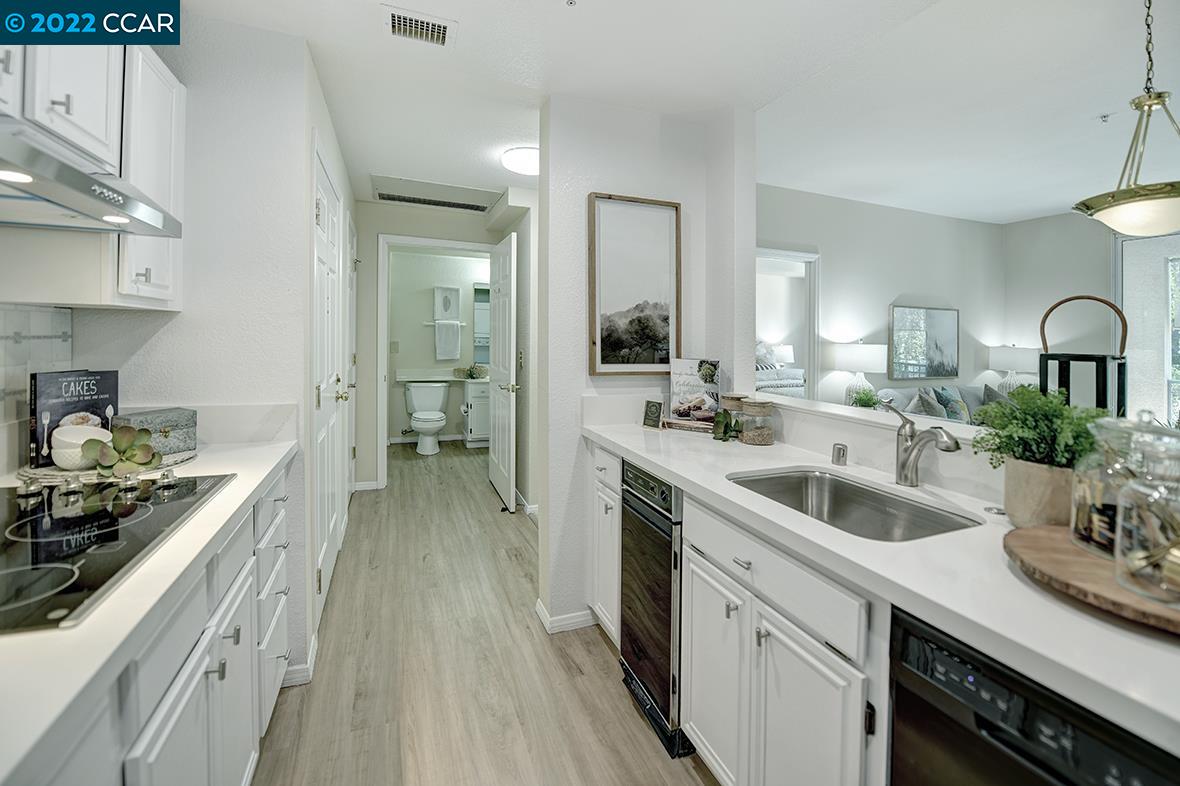 Rossmoor Walnut Creek, CA 94595 - Photo 1 of 1 a kitchen with sink stove and cabinets