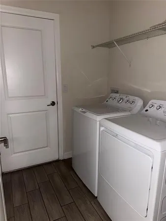a view of a room with shelf on the wall