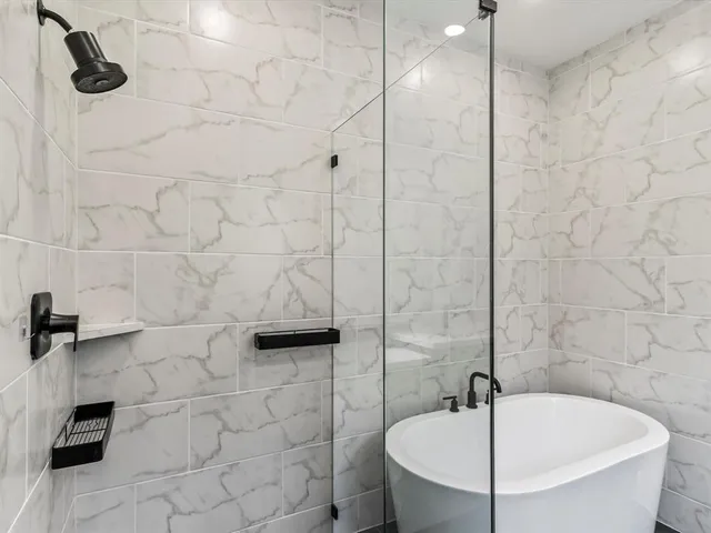 a bathroom with a sink and a shower