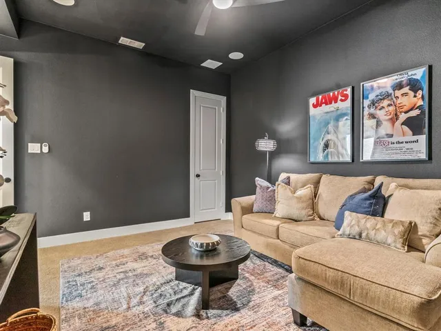 a living room with furniture and a rug