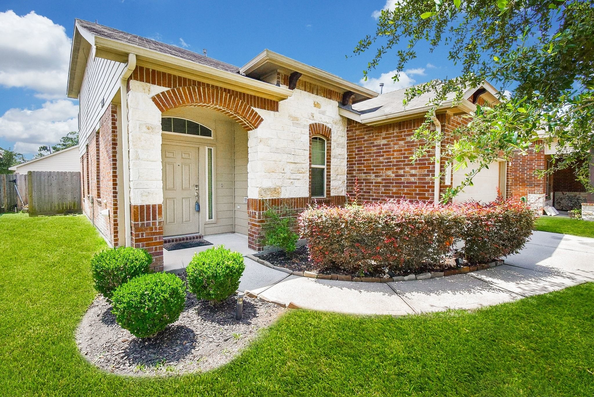 2106 Harmon Crest Court Spring, TX 77373 - Photo 1 of 37 a front view of a house with garden