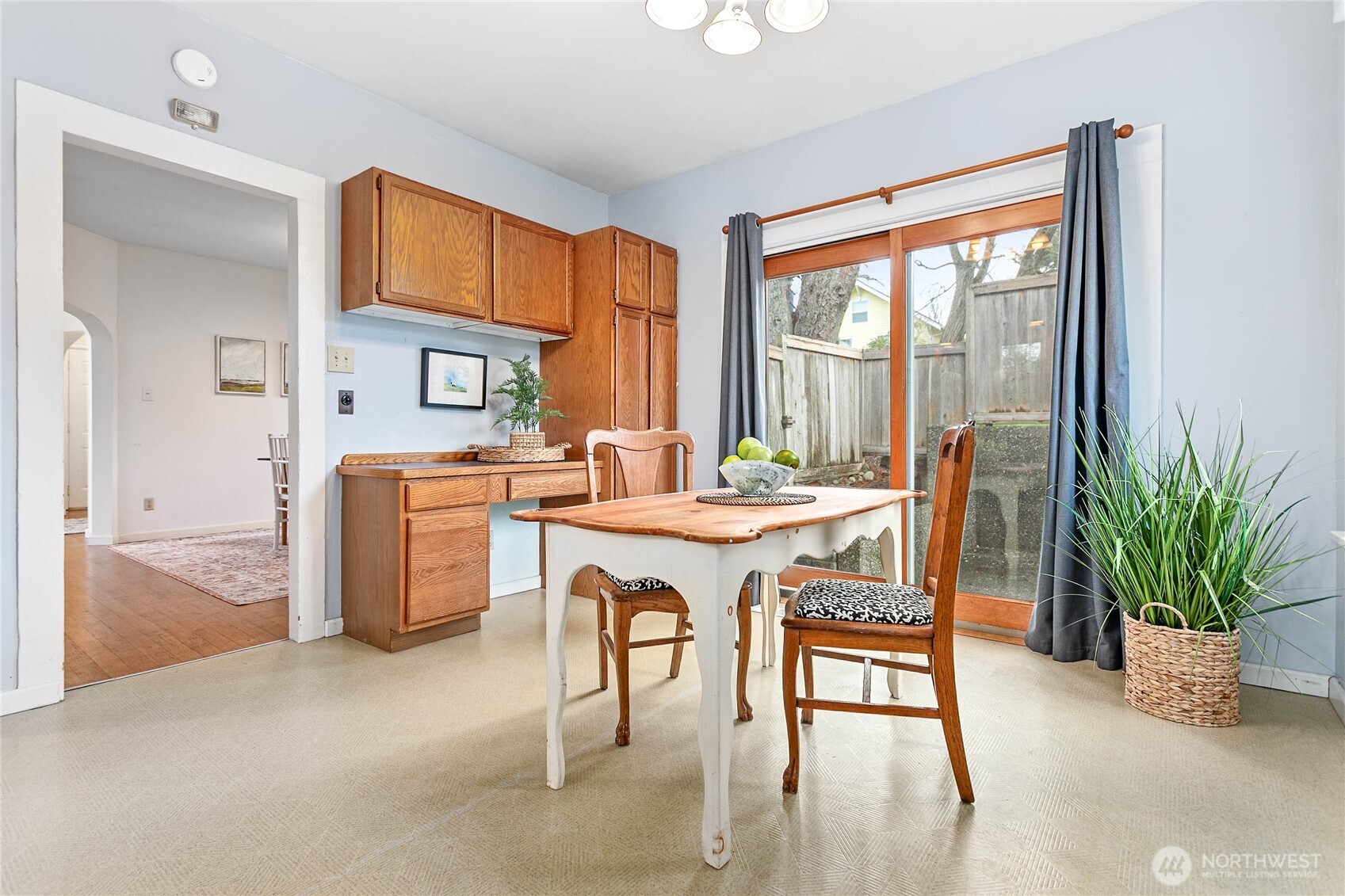 3820 Ohio Street Bellingham, WA 98229 - Photo 15 of 40 a dining room with furniture a potted plant and a kitchen view