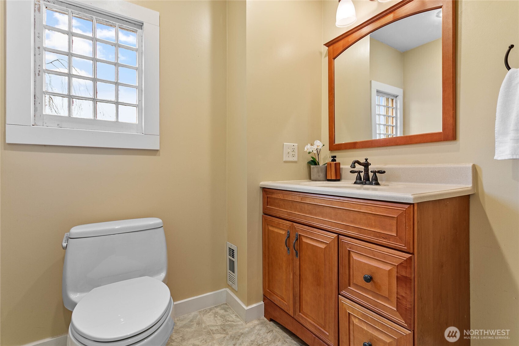 3820 Ohio Street Bellingham, WA 98229 - Photo 19 of 40 a bathroom with a toilet sink and mirror