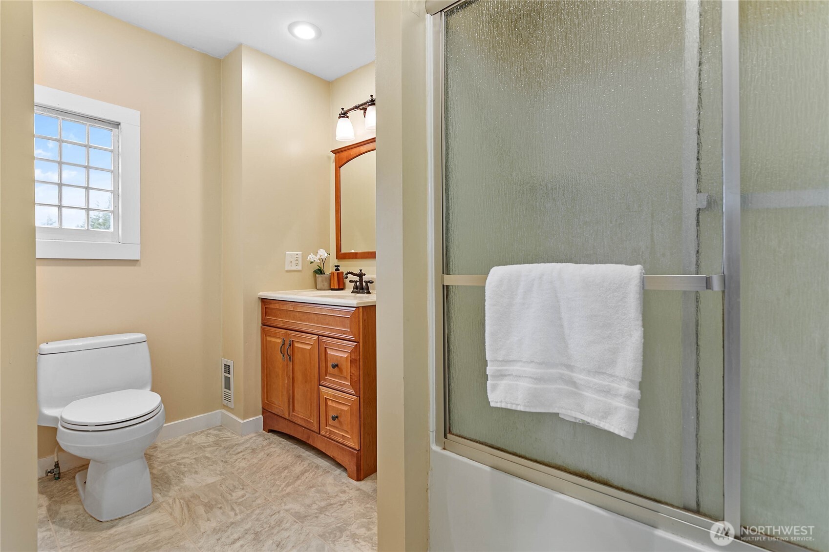 3820 Ohio Street Bellingham, WA 98229 - Photo 20 of 40 a bathroom with a toilet sink and mirror