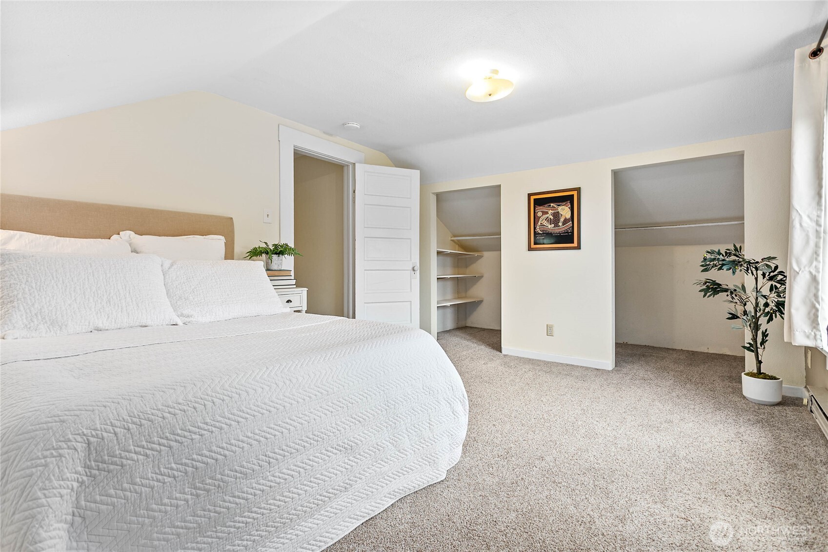 3820 Ohio Street Bellingham, WA 98229 - Photo 21 of 40 a spacious bedroom with a bed and cabinets