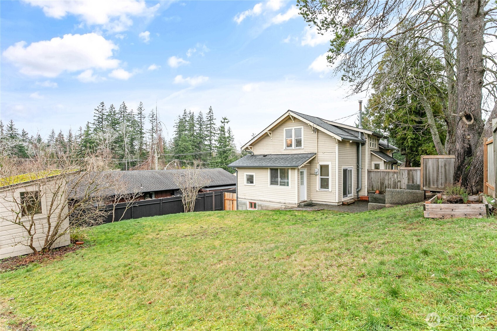 3820 Ohio Street Bellingham, WA 98229 - Photo 36 of 40 a view of a house with a yard and sitting area