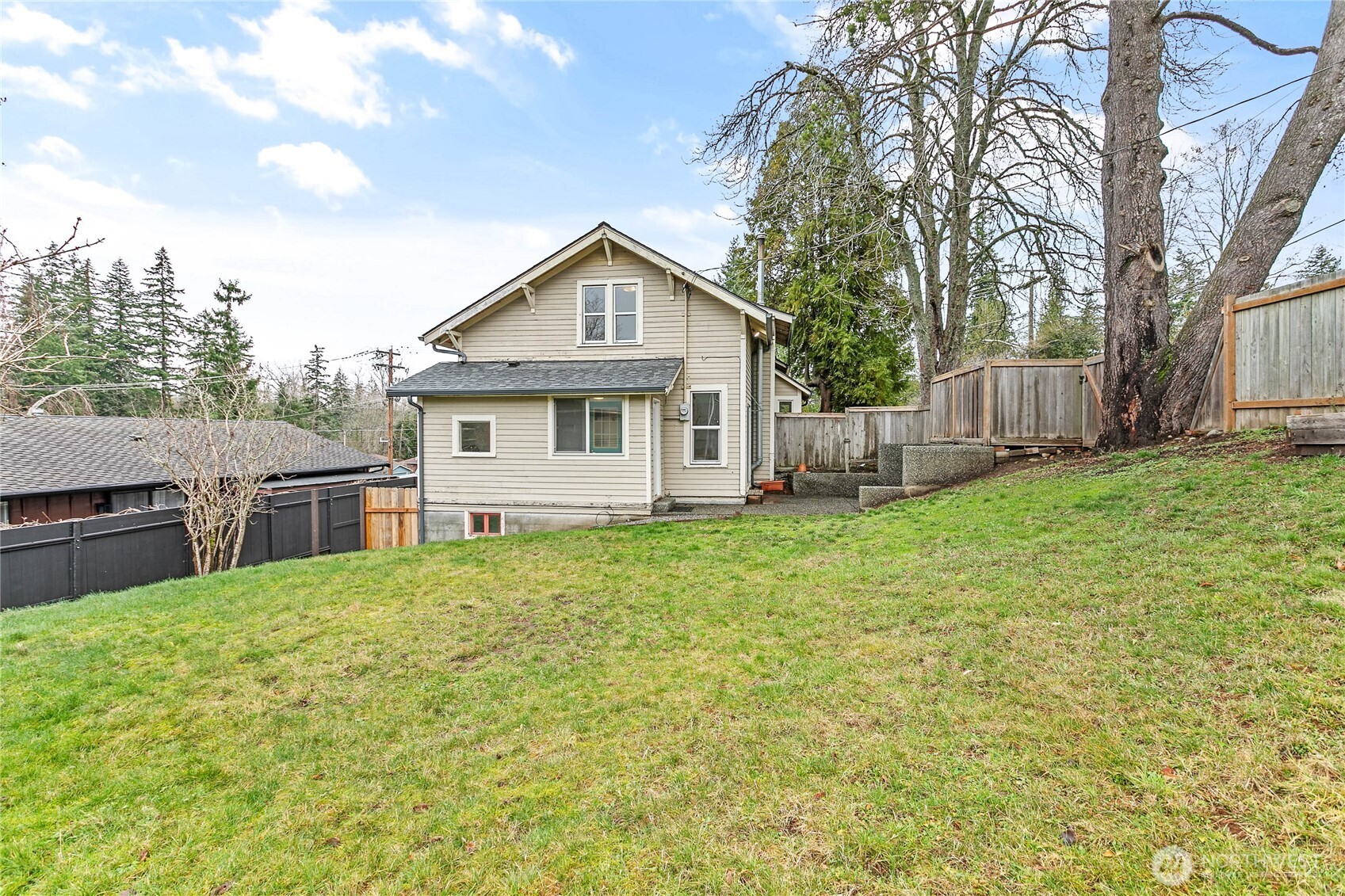 3820 Ohio Street Bellingham, WA 98229 - Photo 39 of 40 a view of a house with backyard and a tree