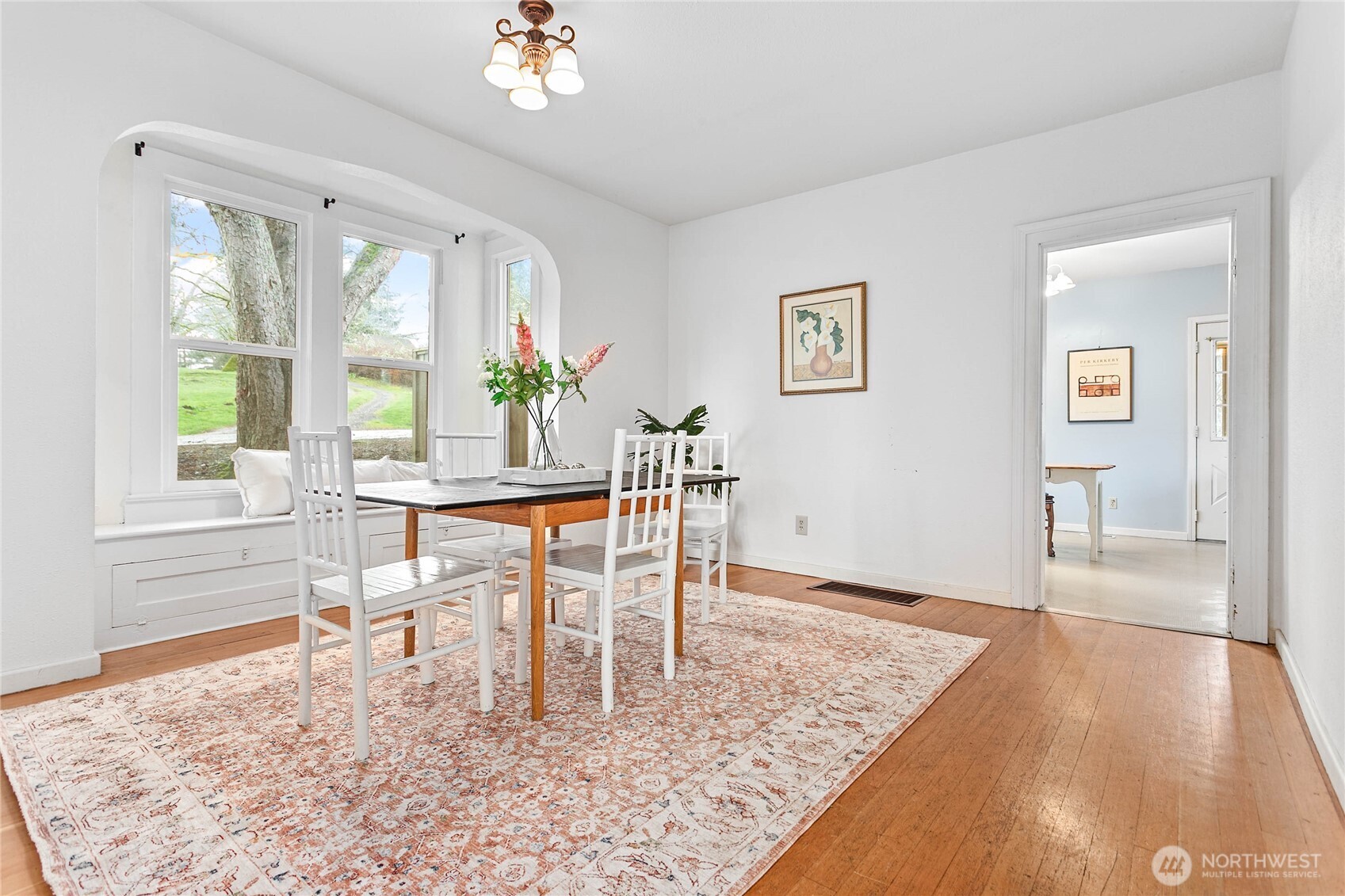 3820 Ohio Street Bellingham, WA 98229 - Photo 8 of 40 a dining room with wooden floor and a rug
