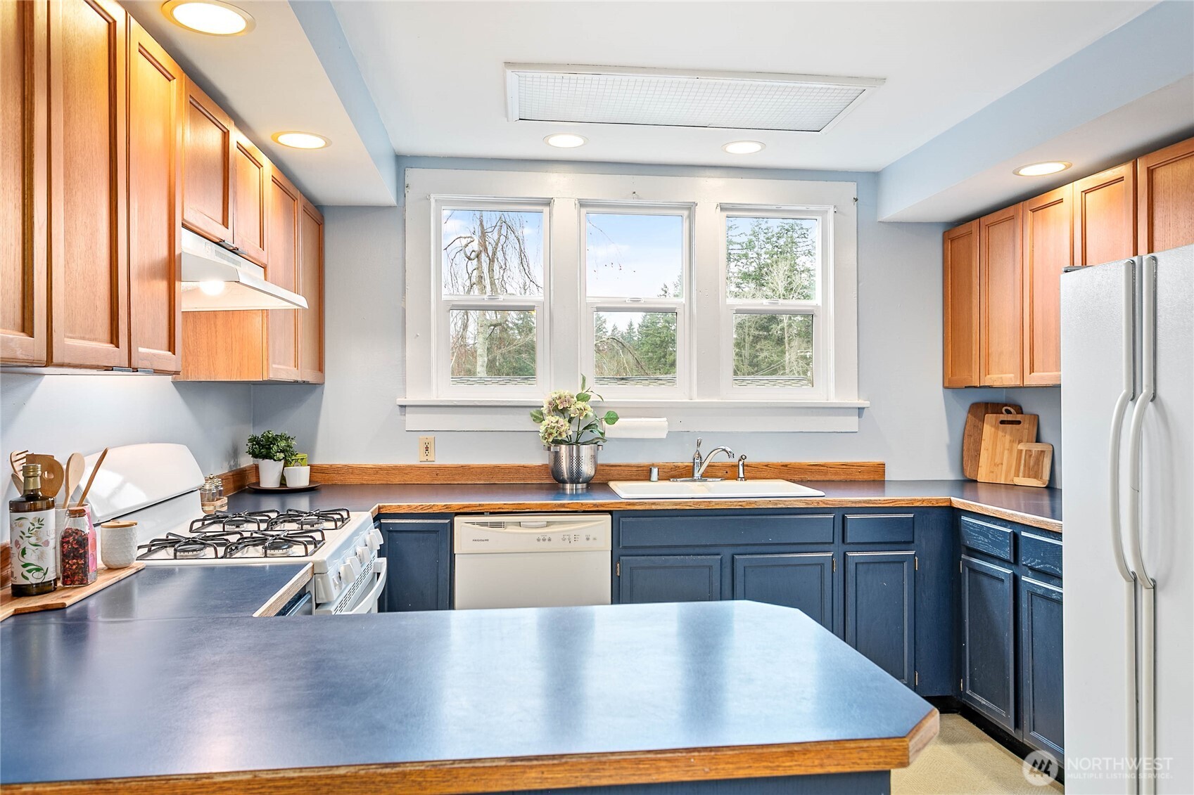 3820 Ohio Street Bellingham, WA 98229 - Photo 10 of 40 a large kitchen with stainless steel appliances granite countertop a sink a stove and refrigerator