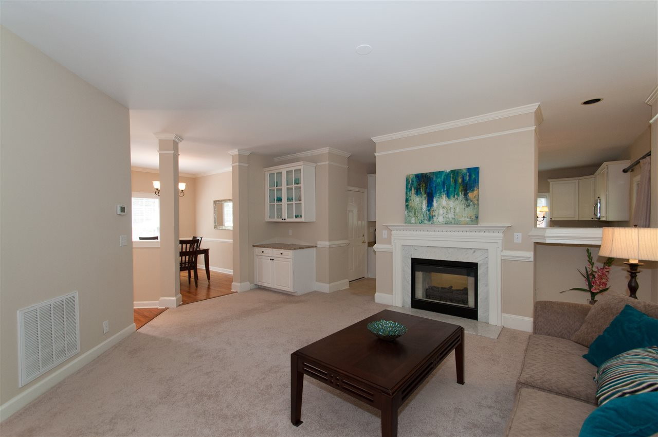 8905 Braceridge Road Raleigh, NC 27613 - Photo 7 of 25 New interior paint 2015. see through fireplace and bar Den/Family/Great Room