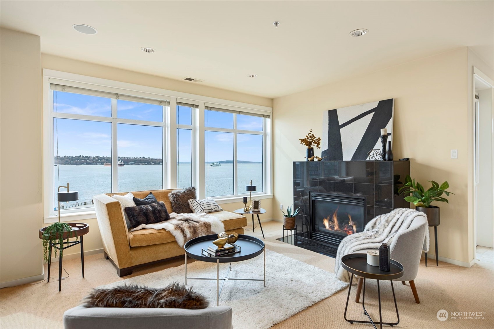 a living room with furniture and a fireplace