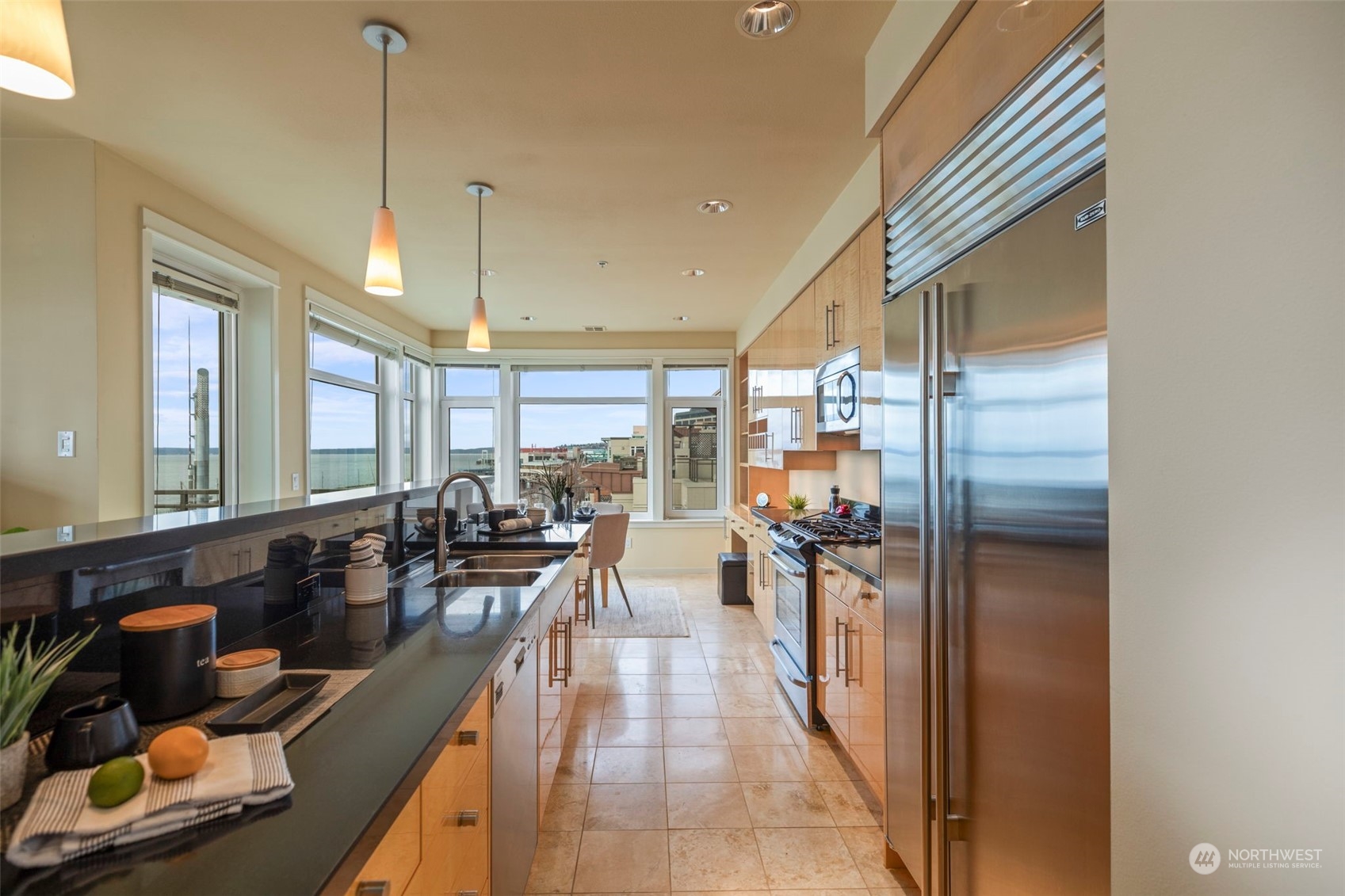 1900 Alaskan Way, Unit 516 Seattle, WA 98101 - Photo 16 of 40 a very nice looking room with a large window and furniture