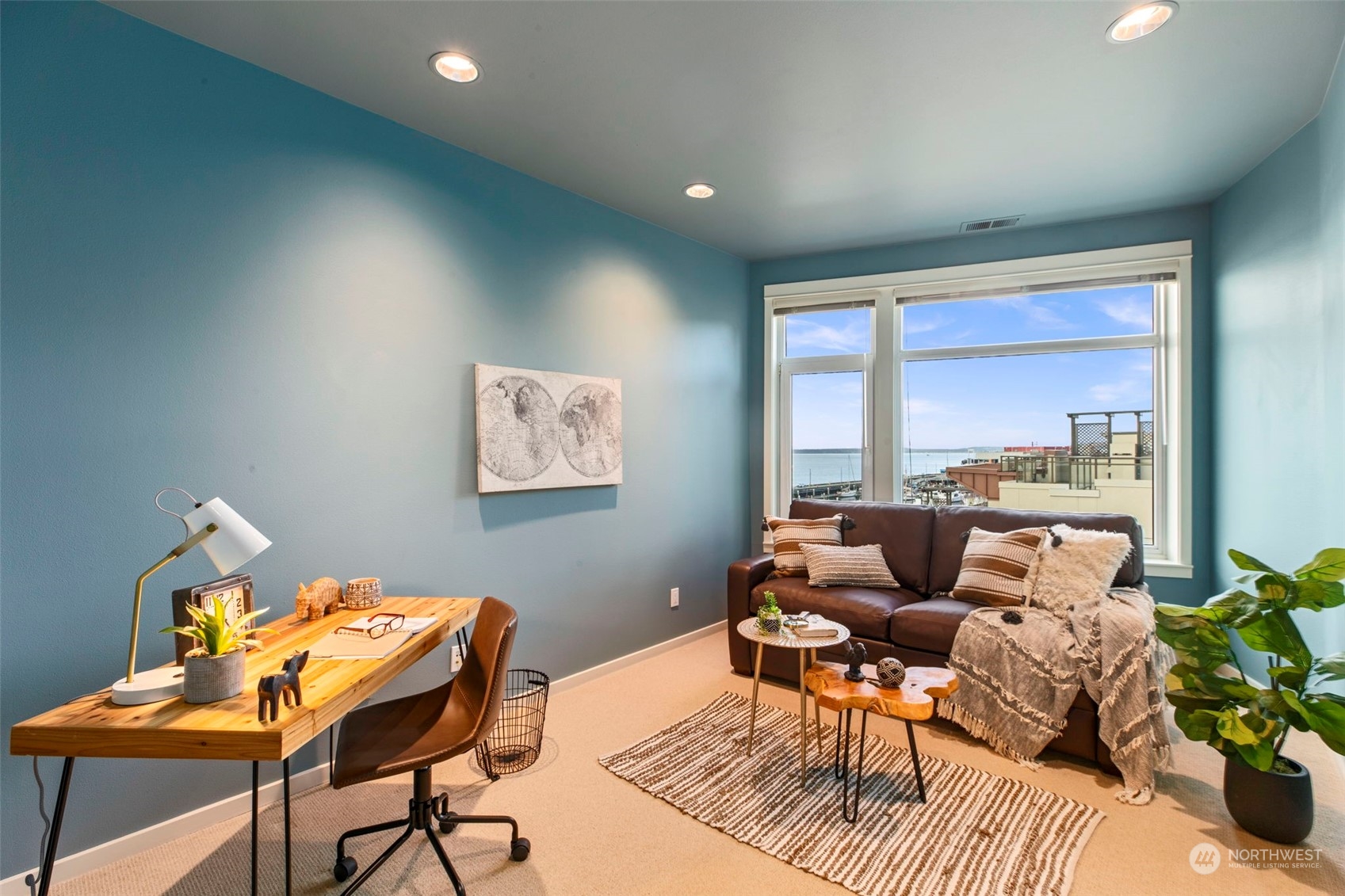 1900 Alaskan Way, Unit 516 Seattle, WA 98101 - Photo 21 of 40 a living room with furniture and a large window