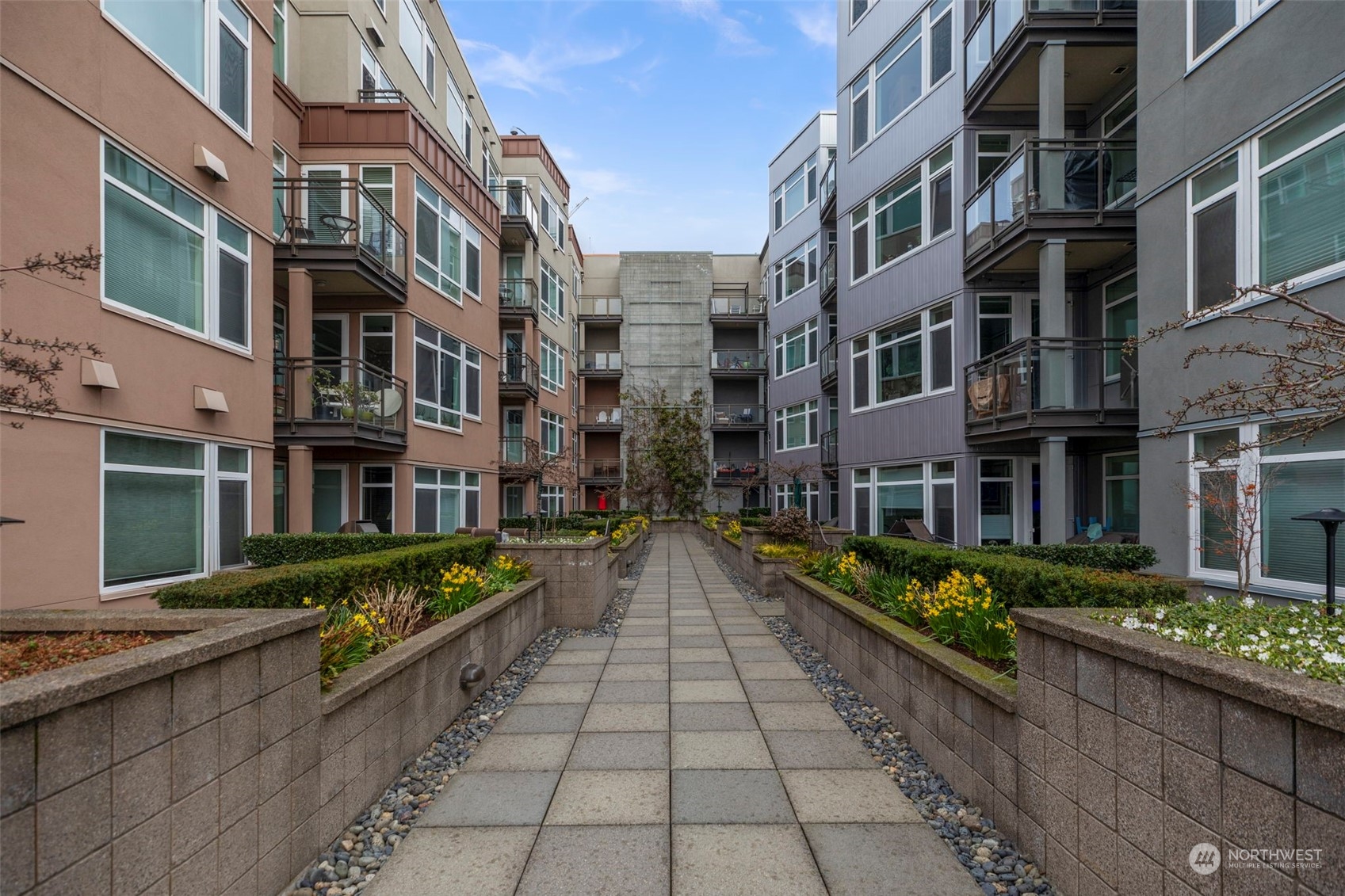 1900 Alaskan Way, Unit 516 Seattle, WA 98101 - Photo 25 of 40 a view of a brick building with many windows