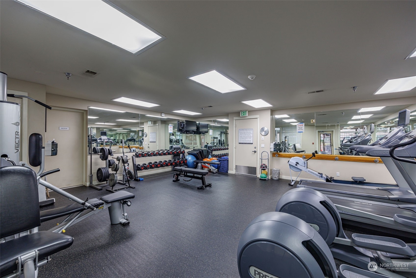 1900 Alaskan Way, Unit 516 Seattle, WA 98101 - Photo 27 of 40 a room with lots of gym equipment