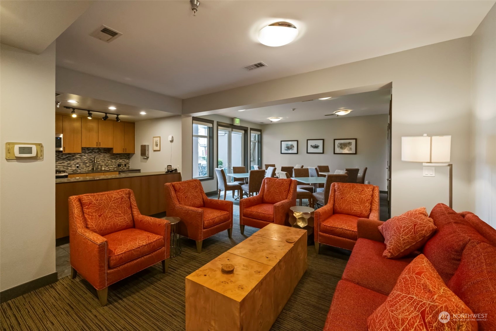 1900 Alaskan Way, Unit 516 Seattle, WA 98101 - Photo 28 of 40 a living room with furniture kitchen view and a wooden floor