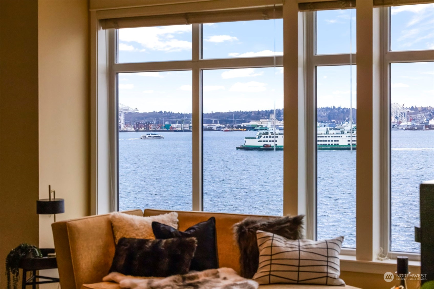 1900 Alaskan Way, Unit 516 Seattle, WA 98101 - Photo 30 of 40 a living room with couches and large windows