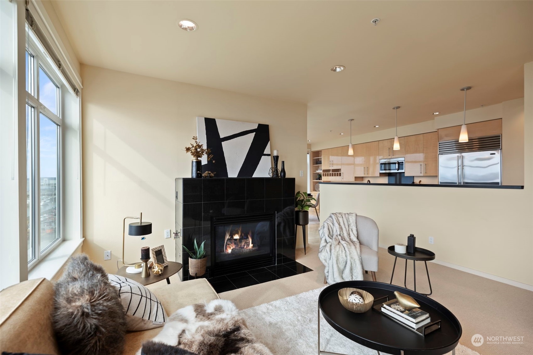 1900 Alaskan Way, Unit 516 Seattle, WA 98101 - Photo 3 of 40 a living room with furniture and a fireplace