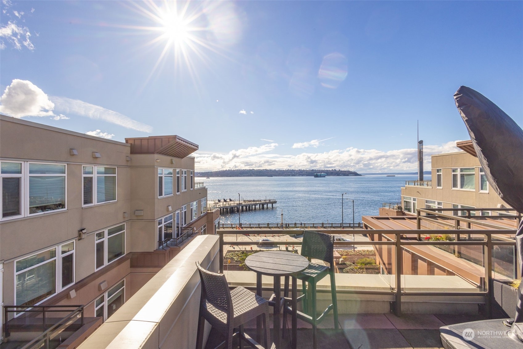 1900 Alaskan Way, Unit 516 Seattle, WA 98101 - Photo 32 of 40 a view of a balcony with chairs