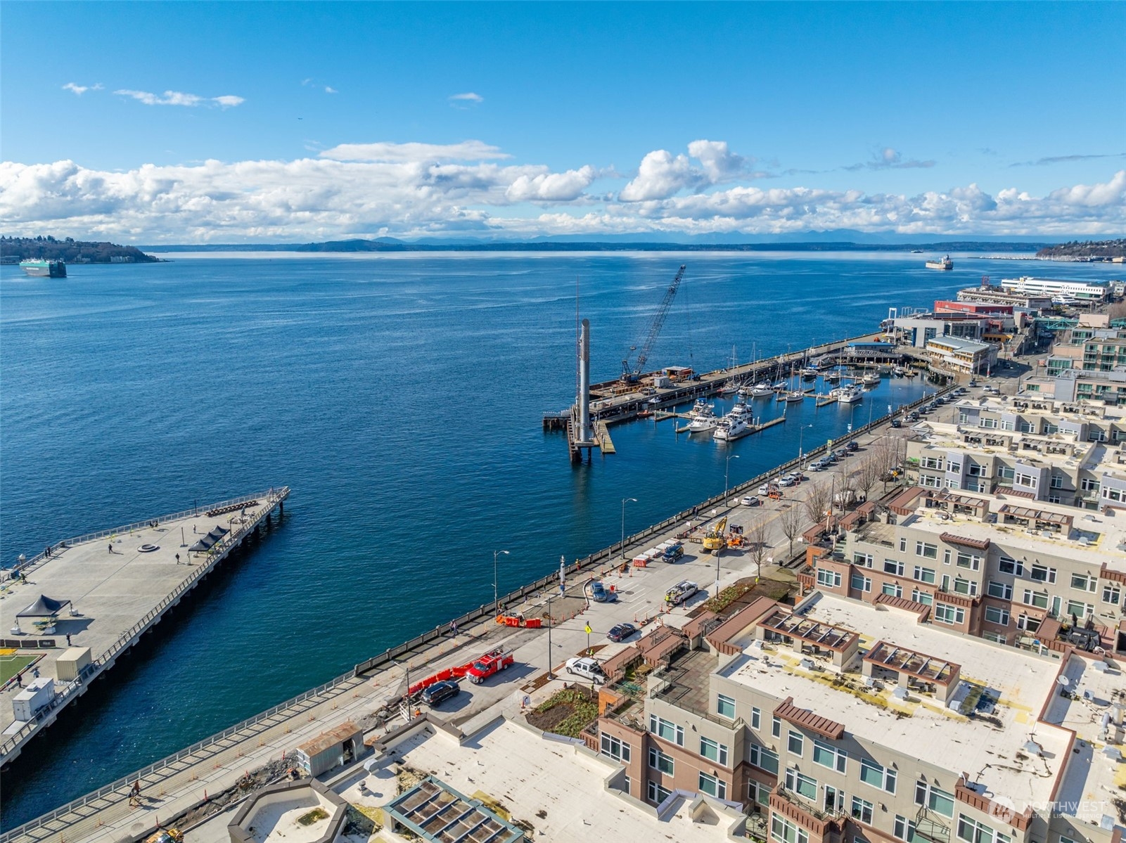 1900 Alaskan Way, Unit 516 Seattle, WA 98101 - Photo 37 of 40 a view of water heater room with wooden floor