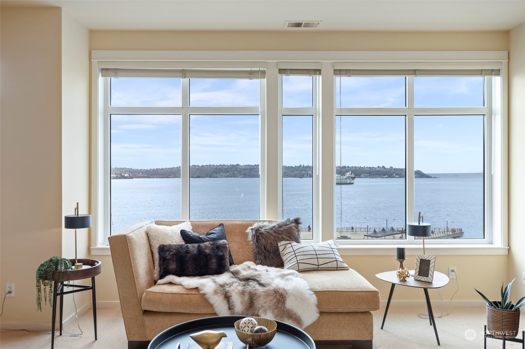 1900 Alaskan Way, Unit 516 Seattle, WA 98101 - Photo 5 of 40 a living room with furniture and a large window