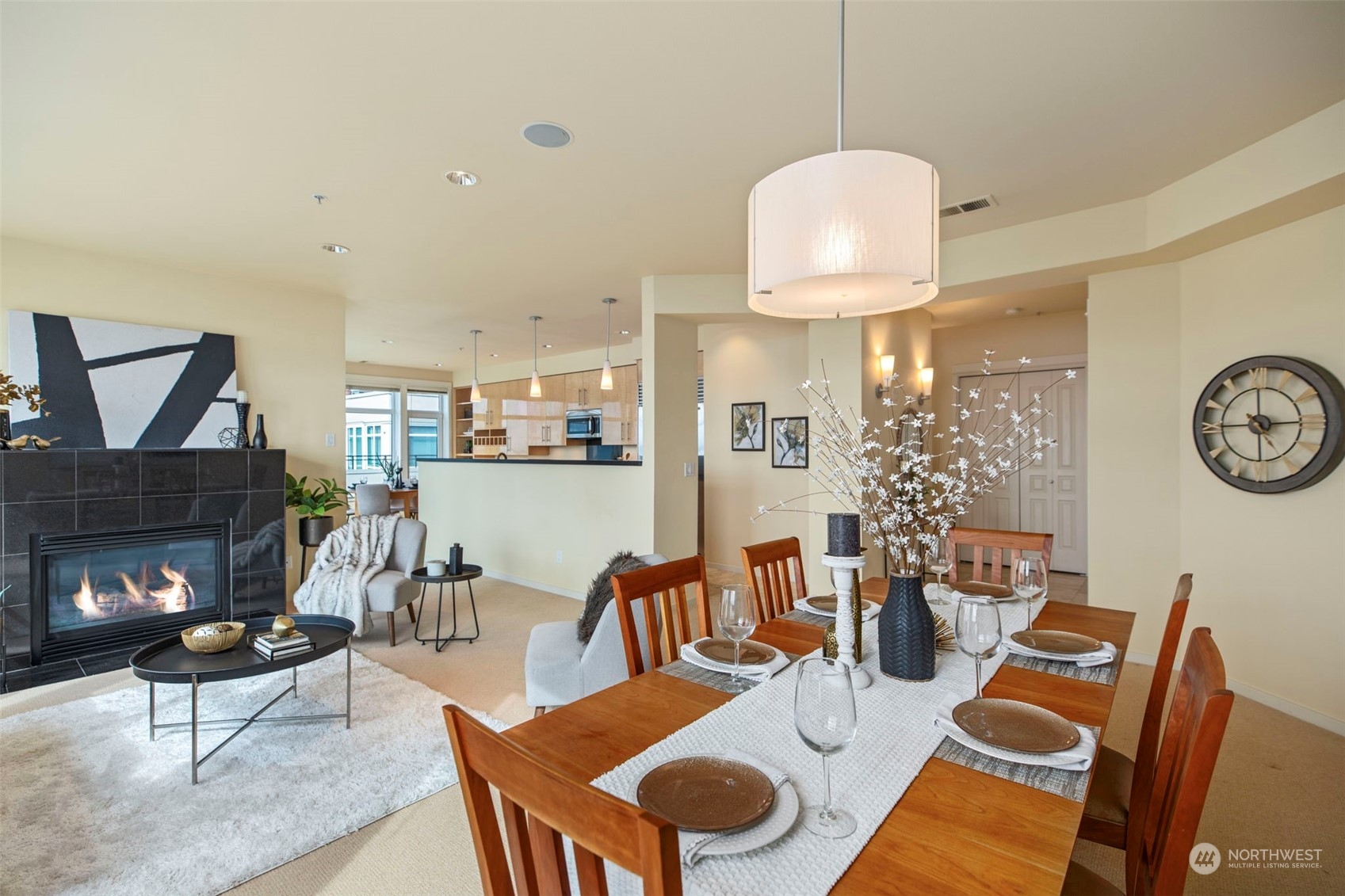 1900 Alaskan Way, Unit 516 Seattle, WA 98101 - Photo 8 of 40 a living room with furniture a rug and a fireplace