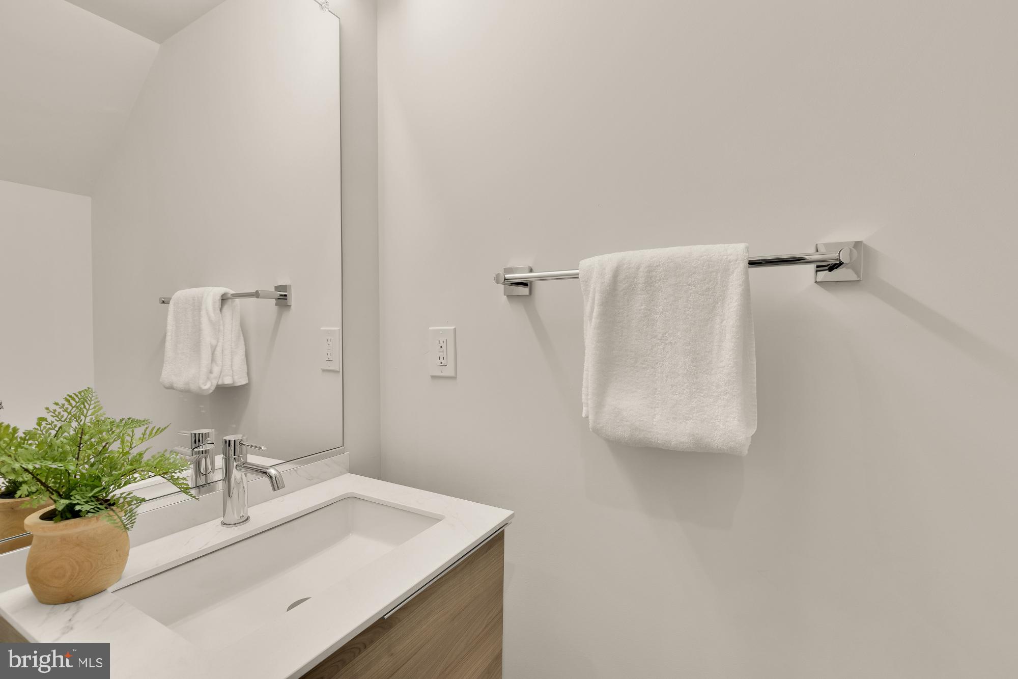 2647 41st Street Northwest, Unit 1 Washington, DC 20007 - Photo 12 of 32 a bathroom with a sink toilet and mirror