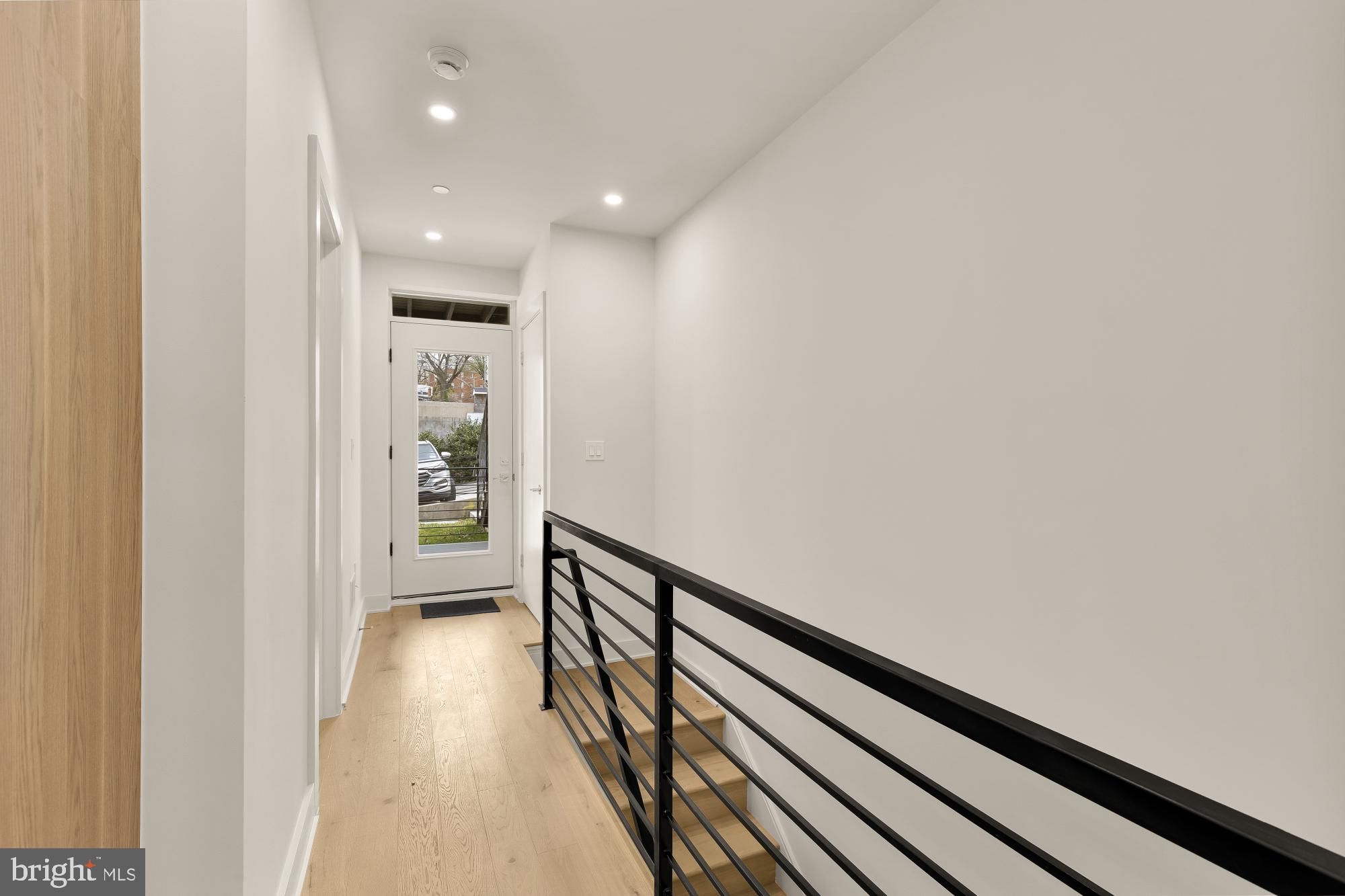 2647 41st Street Northwest, Unit 1 Washington, DC 20007 - Photo 13 of 32 a view of hallway with wooden floor