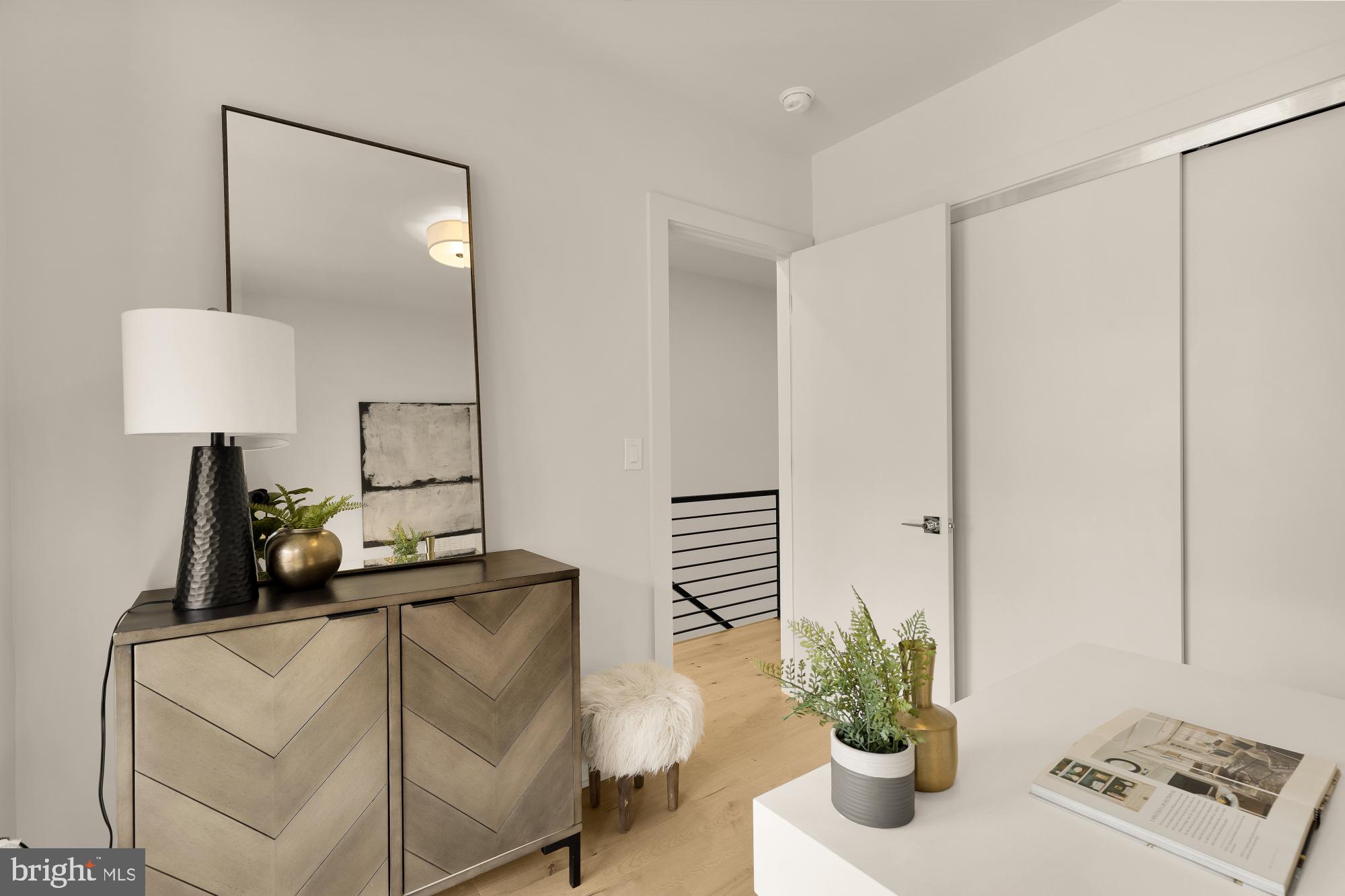 2647 41st Street Northwest, Unit 1 Washington, DC 20007 - Photo 17 of 32 a living room with furniture and a potted plant
