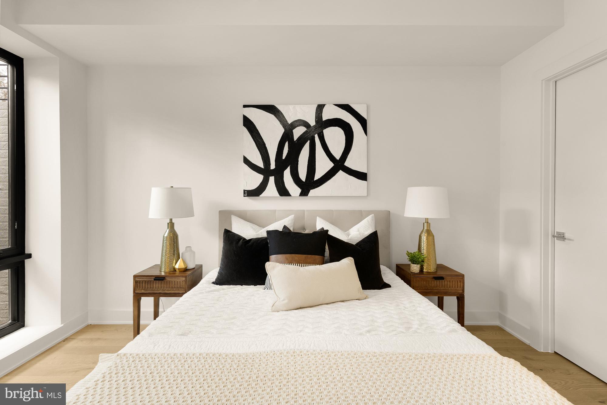 2647 41st Street Northwest, Unit 1 Washington, DC 20007 - Photo 21 of 32 a bedroom with a bed and a night stand