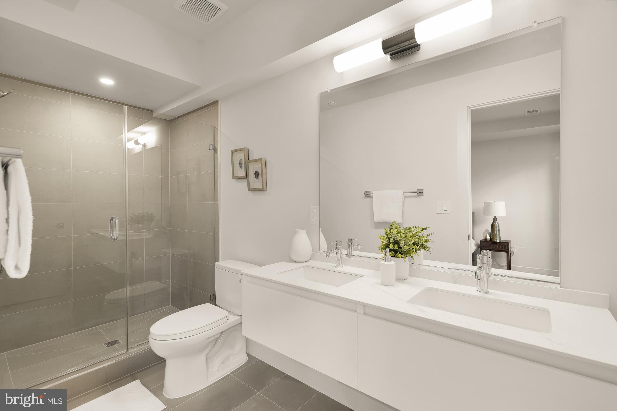 2647 41st Street Northwest, Unit 1 Washington, DC 20007 - Photo 23 of 32 a bathroom with a sink a toilet and shower