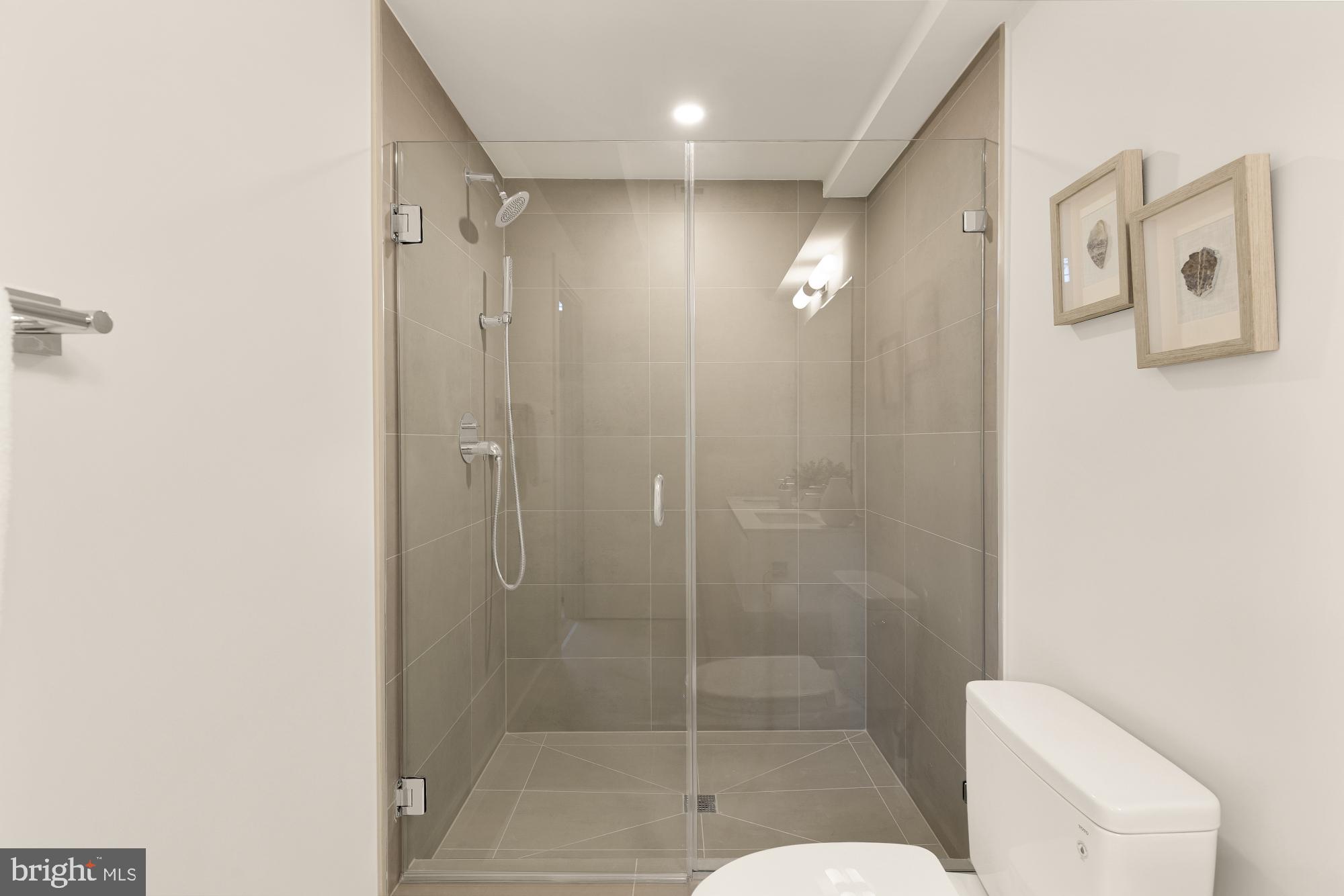 2647 41st Street Northwest, Unit 1 Washington, DC 20007 - Photo 24 of 32 a bathroom with a shower and toilet