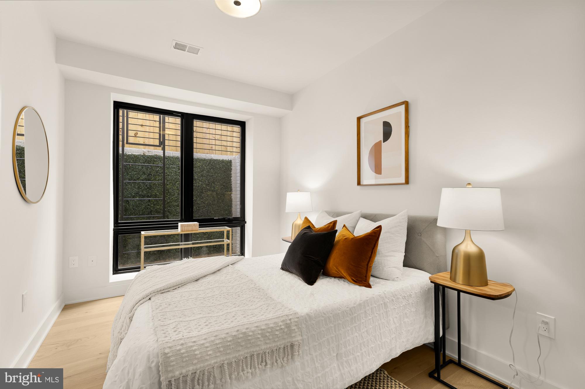 2647 41st Street Northwest, Unit 1 Washington, DC 20007 - Photo 27 of 32 a bedroom with a bed and wooden floor