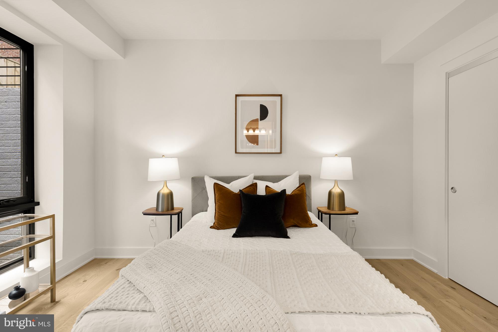 2647 41st Street Northwest, Unit 1 Washington, DC 20007 - Photo 28 of 32 a bedroom with a bed and a flat screen tv