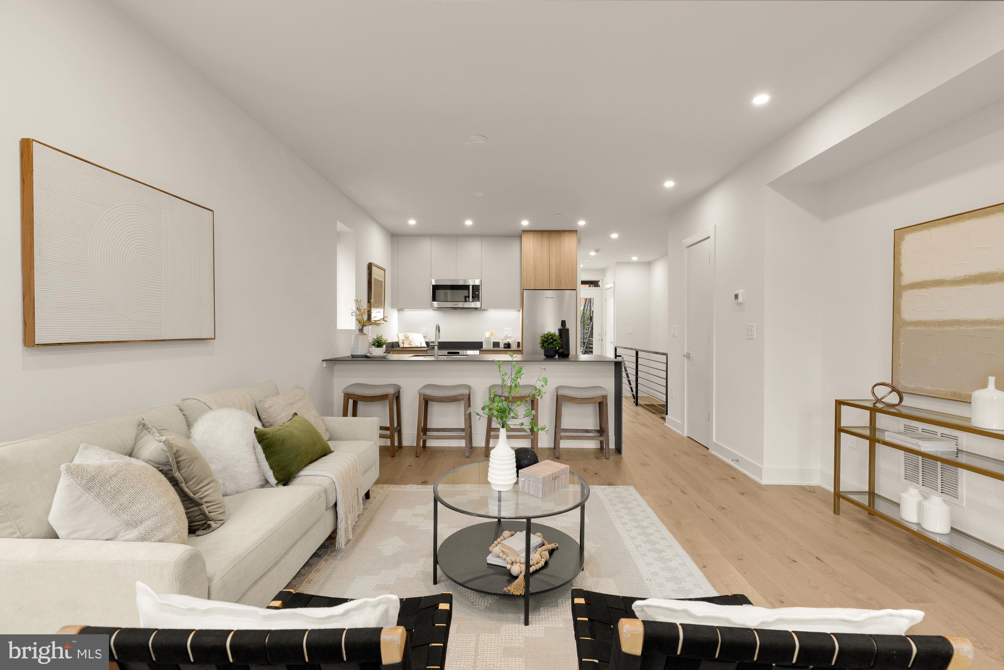 2647 41st Street Northwest, Unit 1 Washington, DC 20007 - Photo 4 of 32 a living room with stainless steel appliances kitchen island granite countertop furniture and a view of kitchen