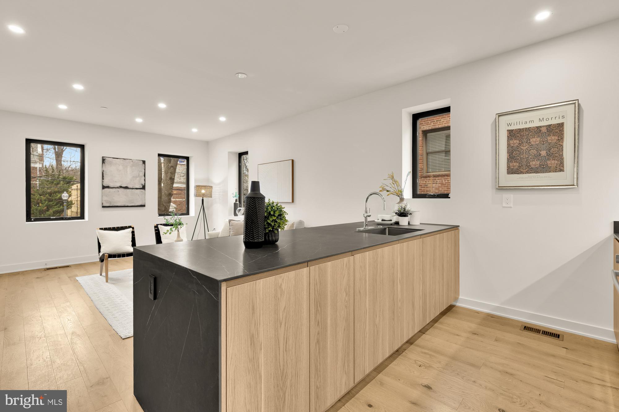 2647 41st Street Northwest, Unit 1 Washington, DC 20007 - Photo 7 of 32 a kitchen with stainless steel appliances granite countertop a sink and a refrigerator